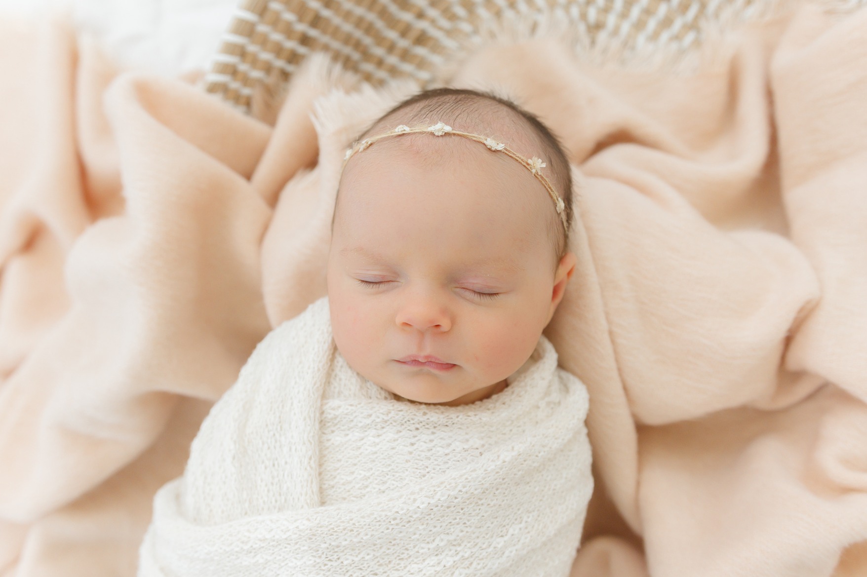 a baby girl in her newborn photos